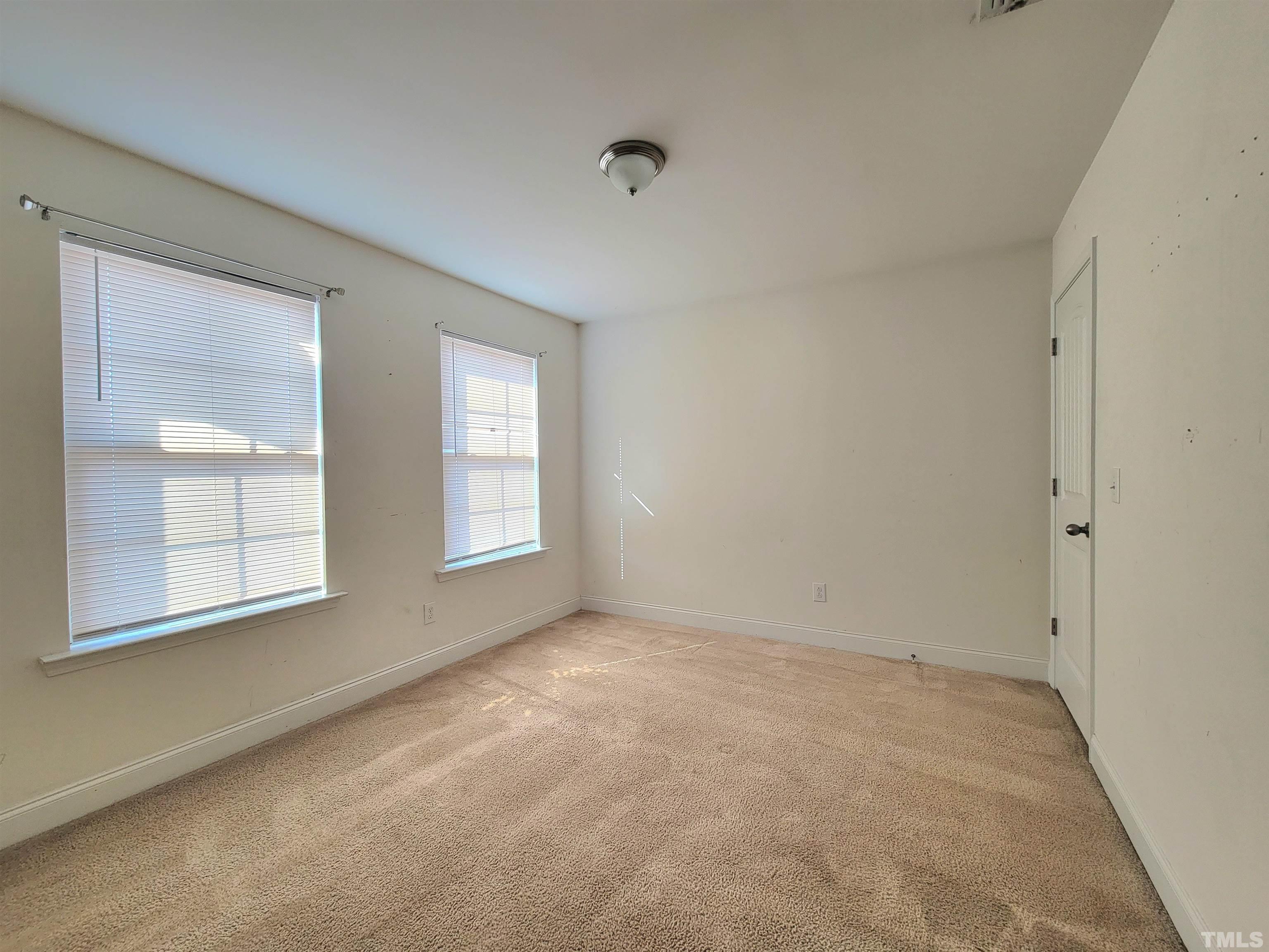 2719 Follow Me Way Raleigh, NC 27610 - Photo 16 of 25 an empty room with windows