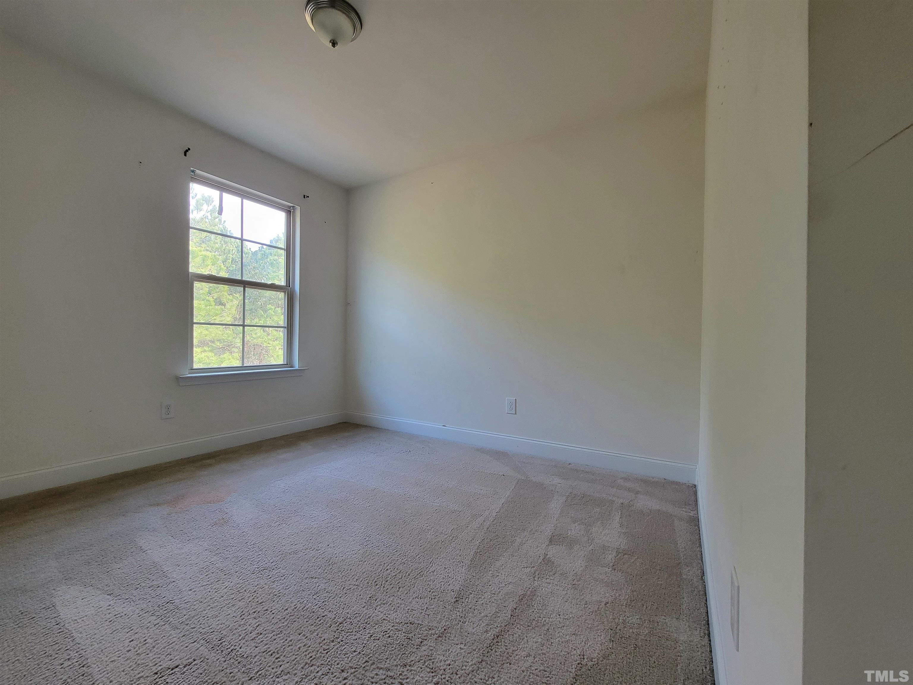 2719 Follow Me Way Raleigh, NC 27610 - Photo 19 of 25 an empty room with windows