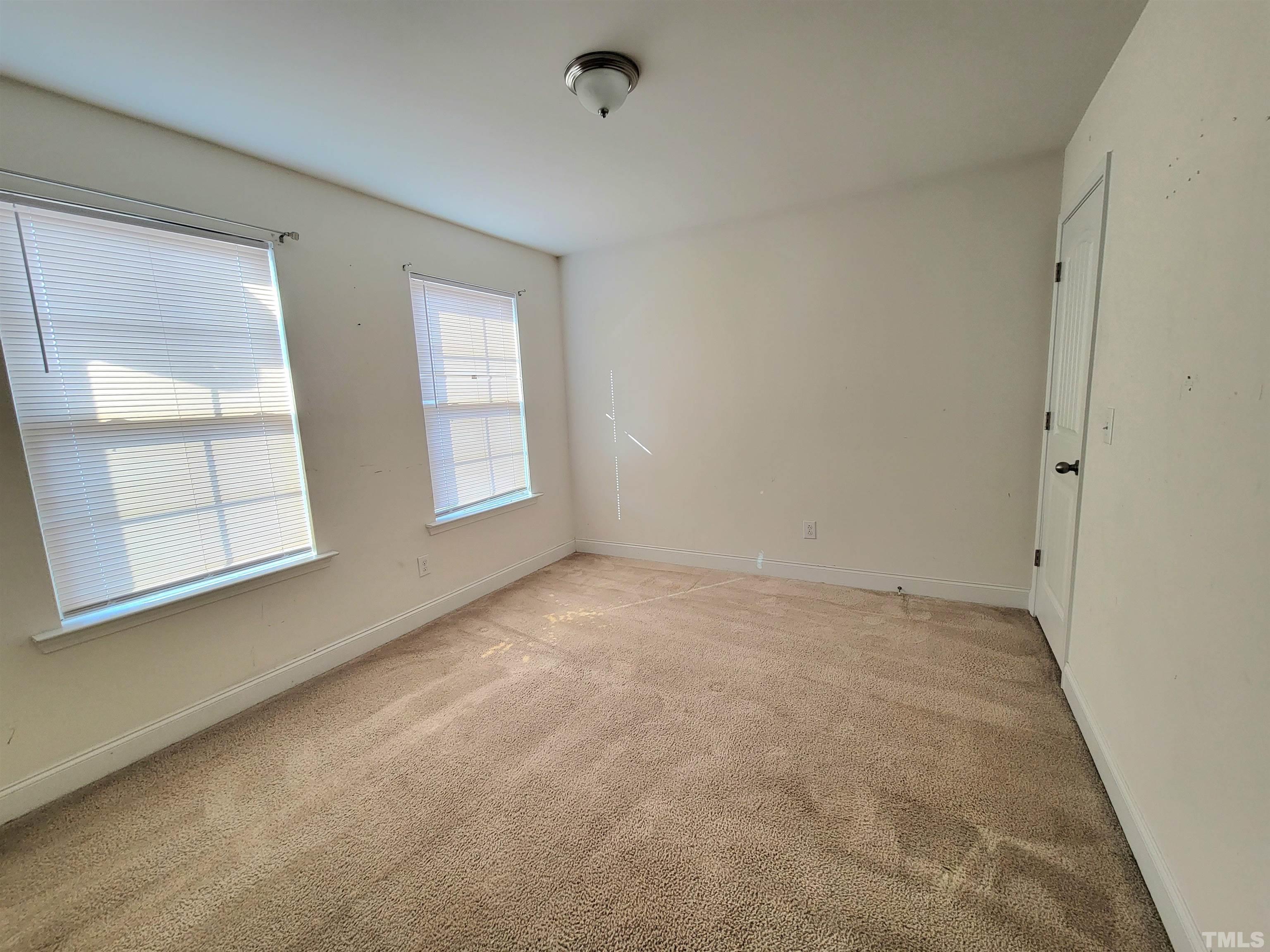 2719 Follow Me Way Raleigh, NC 27610 - Photo 23 of 25 an empty room with windows