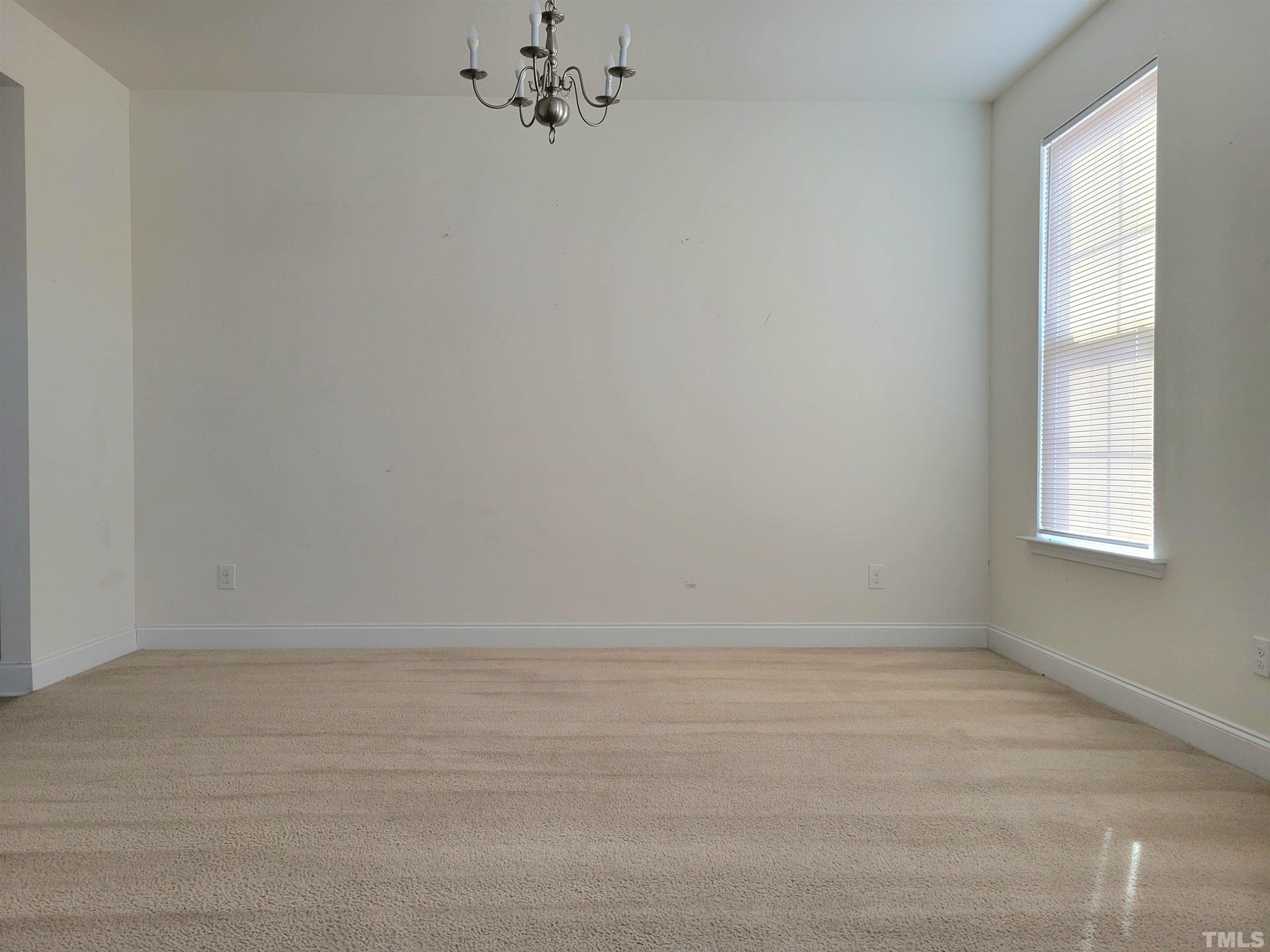 2719 Follow Me Way Raleigh, NC 27610 - Photo 3 of 25 a view of an empty room with a window