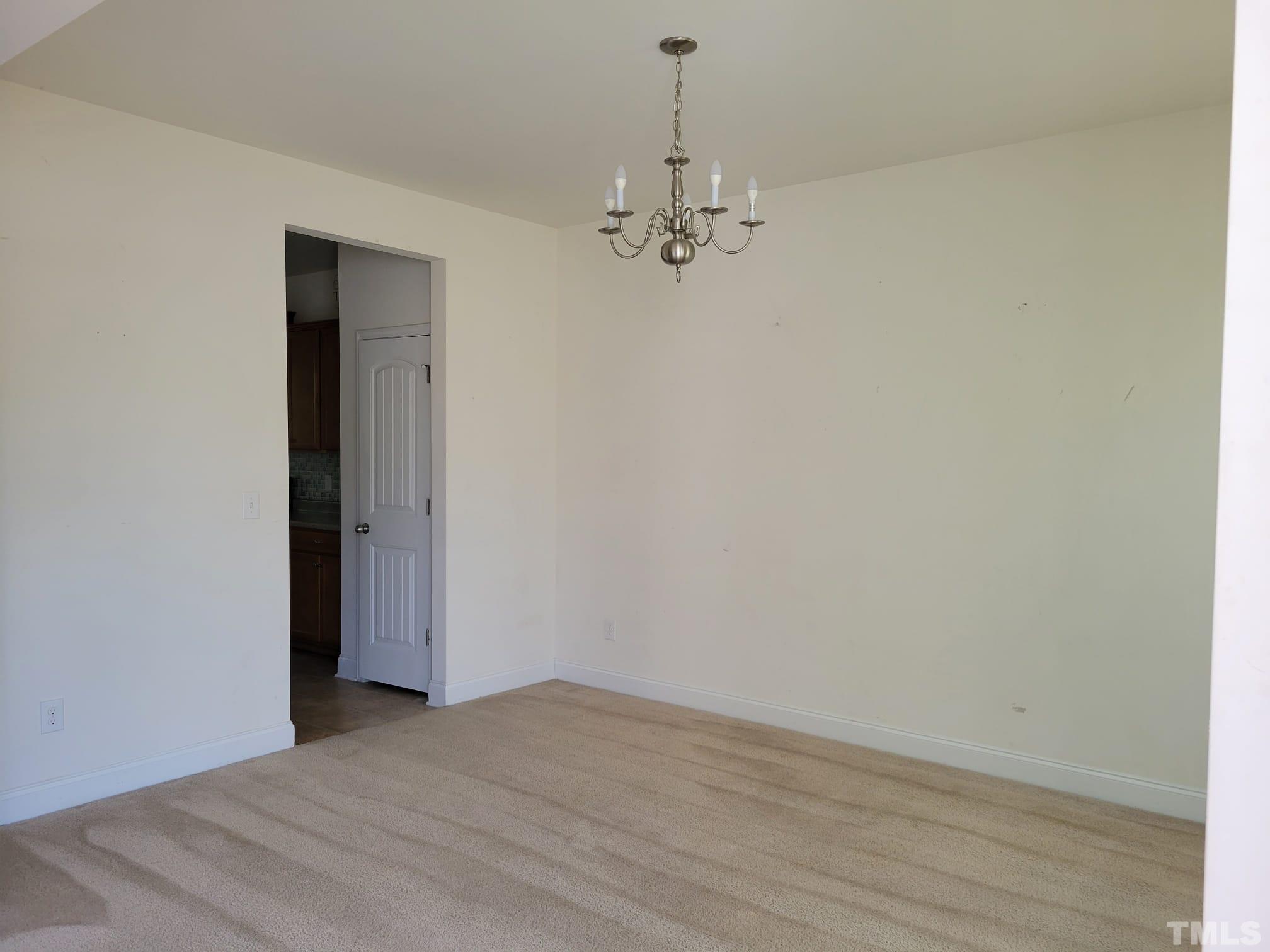 2719 Follow Me Way Raleigh, NC 27610 - Photo 5 of 25 a view of empty room with wooden floor