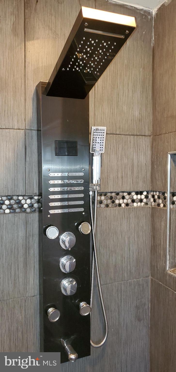 9627 Mendoza Road Randallstown, MD 21133 - Photo 23 of 42 A shower with body sprayers!