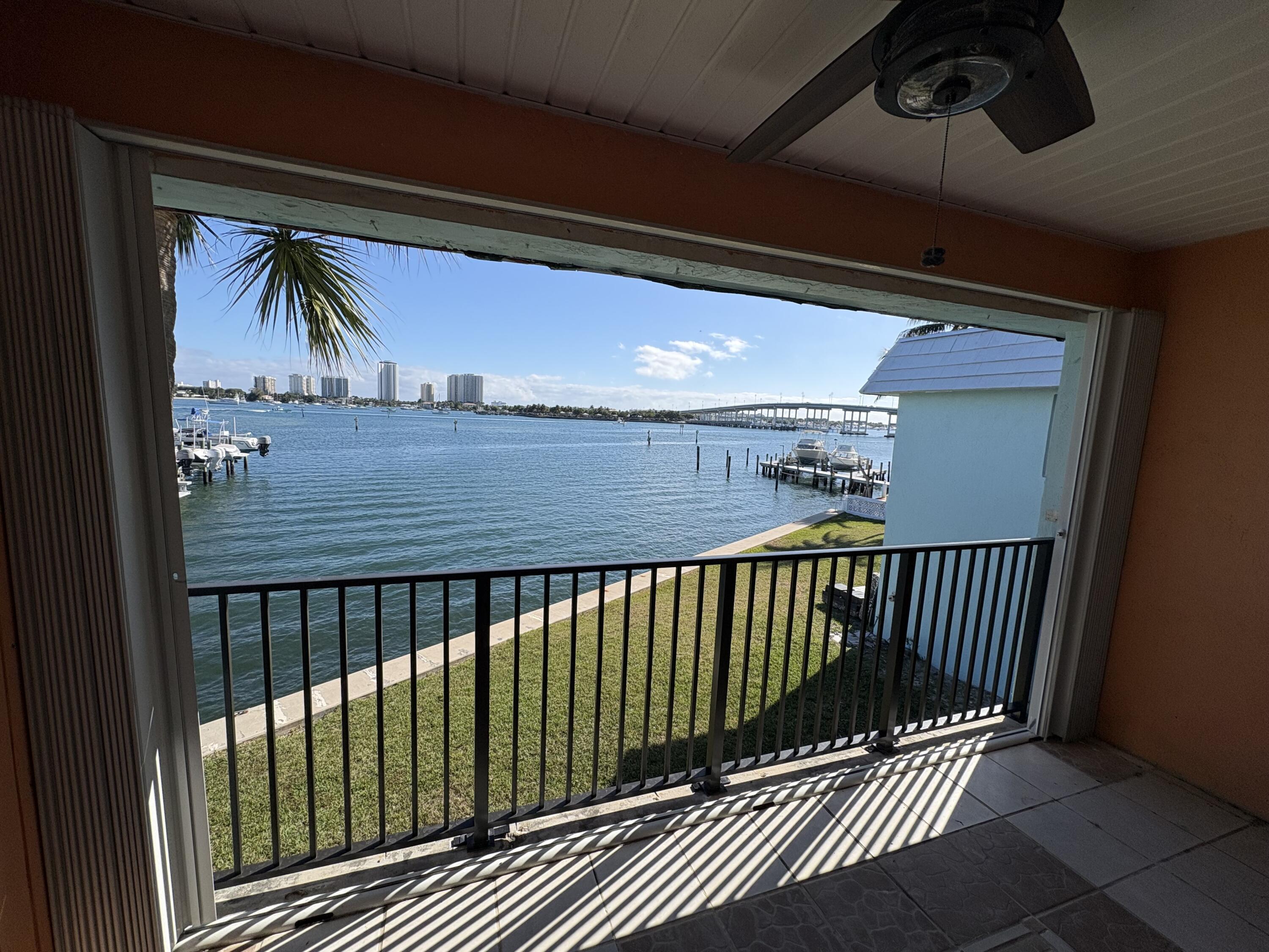 360 Wilma Circle, Unit 5 Riviera Beach, FL 33404 - Photo 11 of 16 a view of balcony with wooden floor