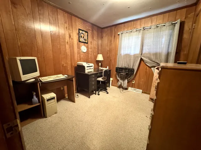 a bed room with a bed furniture and a window