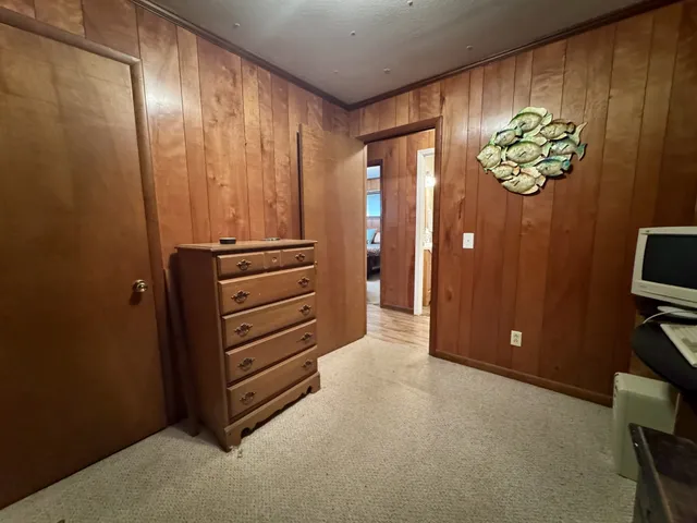 a view of walk in closet with fan