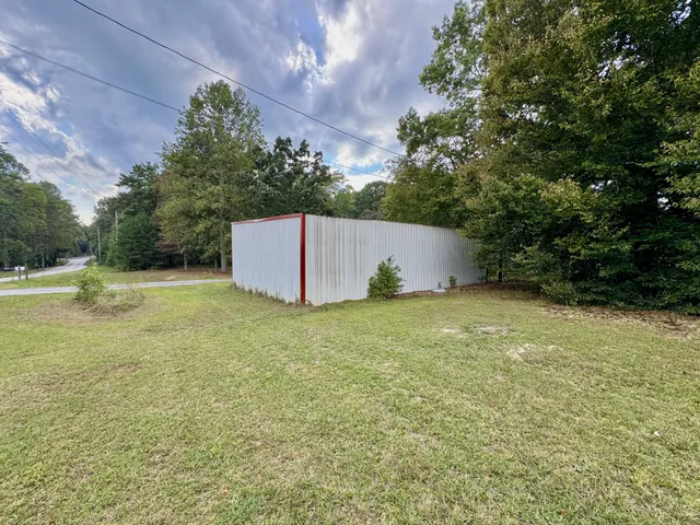 a backyard of a house with lots of green space