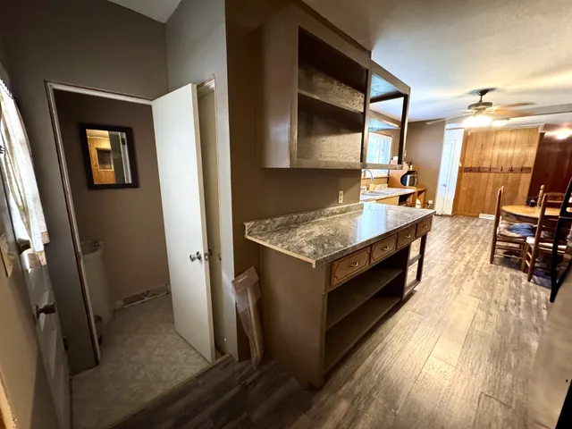 a kitchen with sink refrigerator and microwave