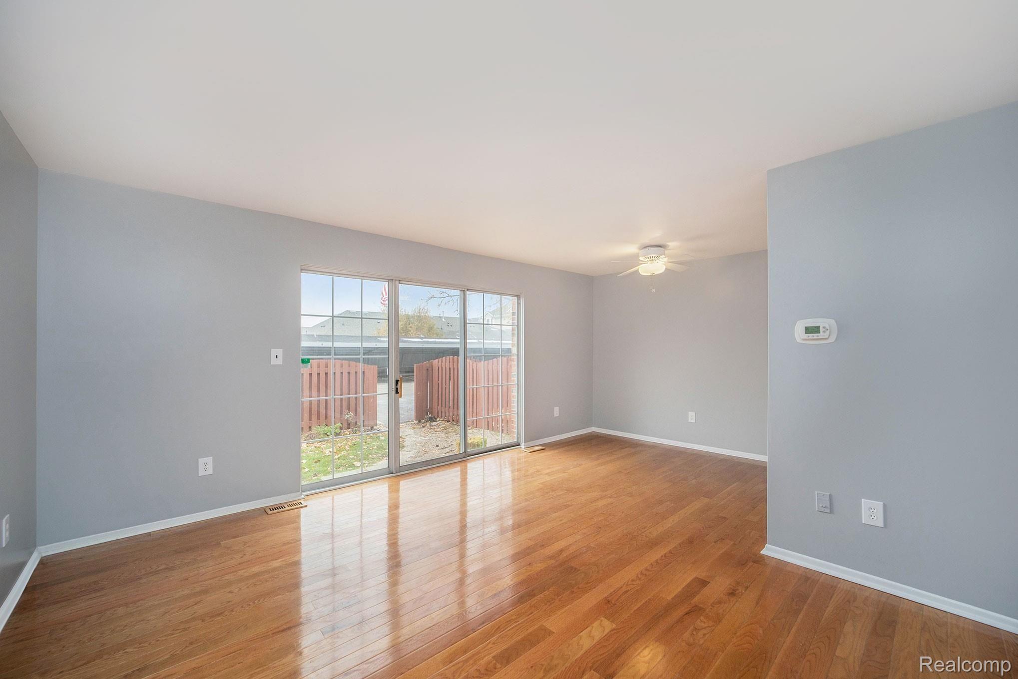 3443 Crooks Road Royal Oak, MI 48073 - Photo 2 of 30 Freshly painted with hardwood floors throughout the great room and formal dining room. Formal dining room with a door-wall leading to the well maintained private backyard.