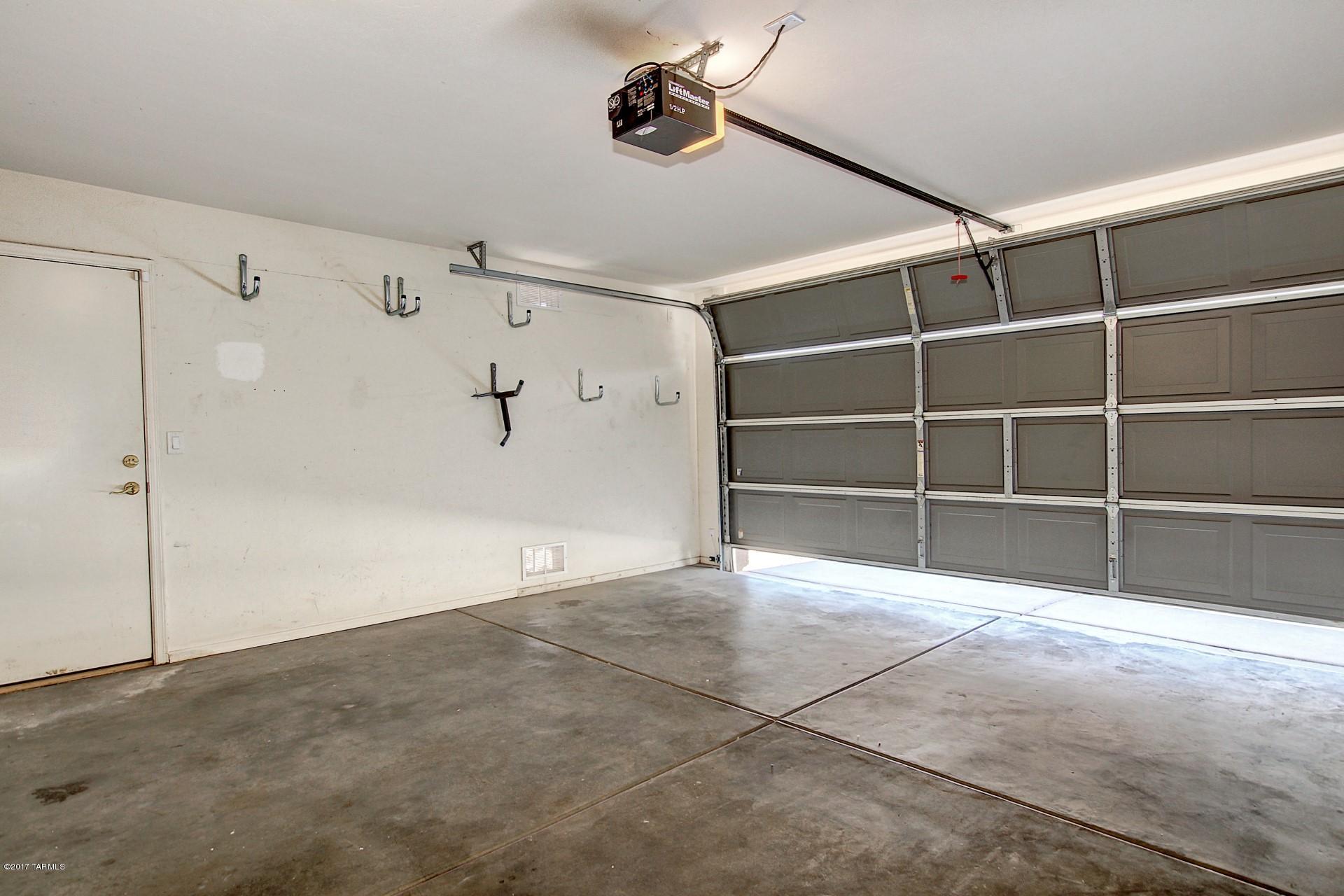 8350 East Bowline Road Tucson, AZ 85710 - Photo 22 of 26 a view of an empty room with a cabinet