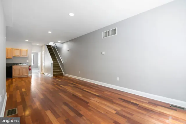 a view of a livingroom with wooden floor