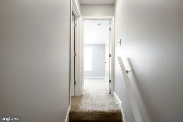 a front view of a house with parking space