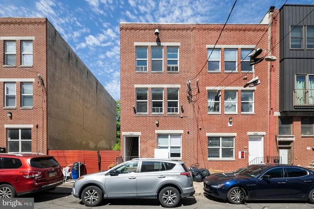 a front view of a building with glass windows