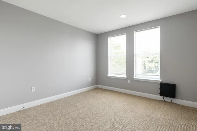 a city street lined with buildings and cars