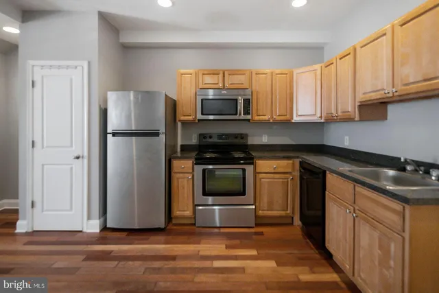 a bathroom with a bathtub a toilet and a shower