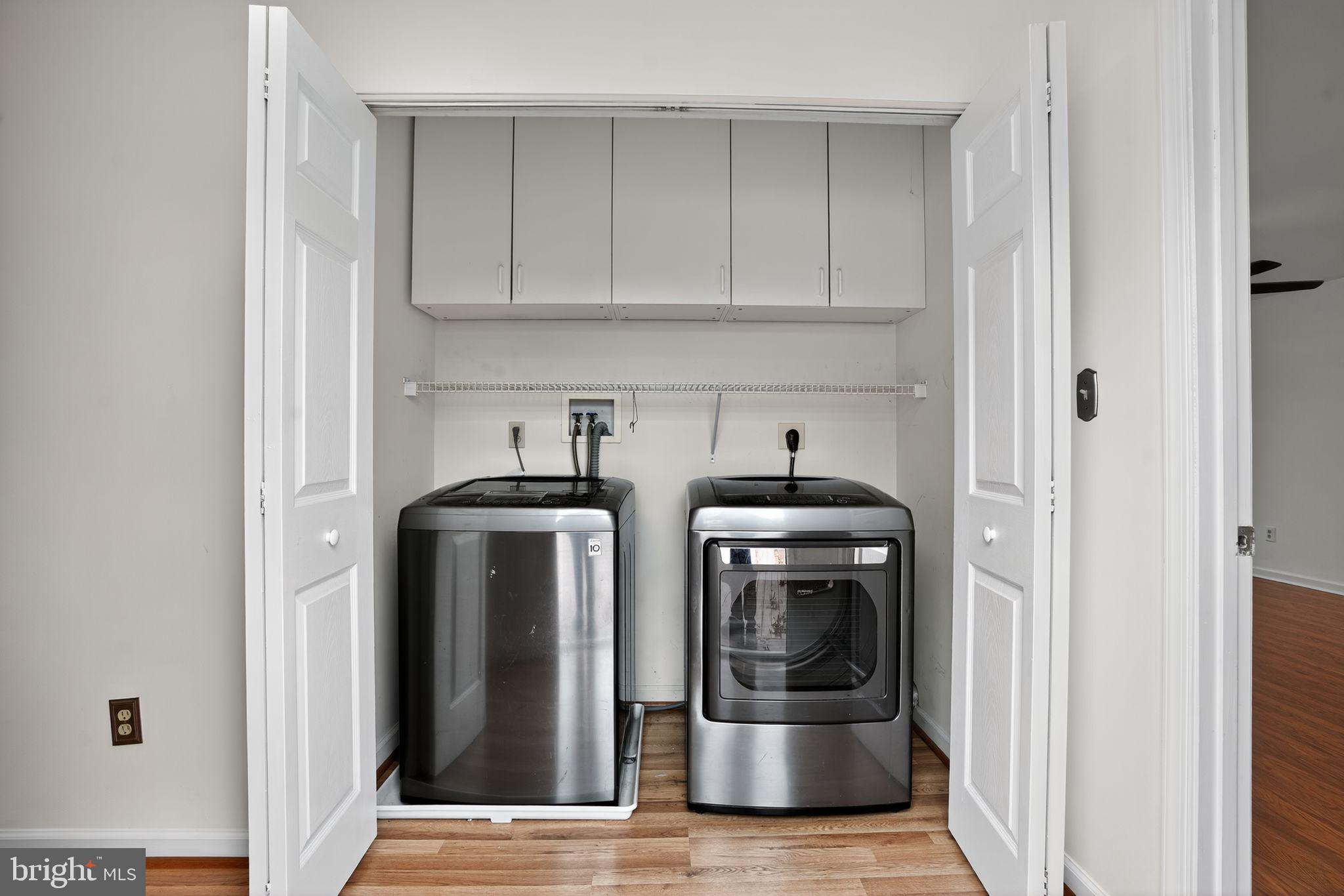 1513 Rainbow Drive Silver Spring, MD 20905 - Photo 16 of 58 a view of kitchen with refrigerator and cabinets