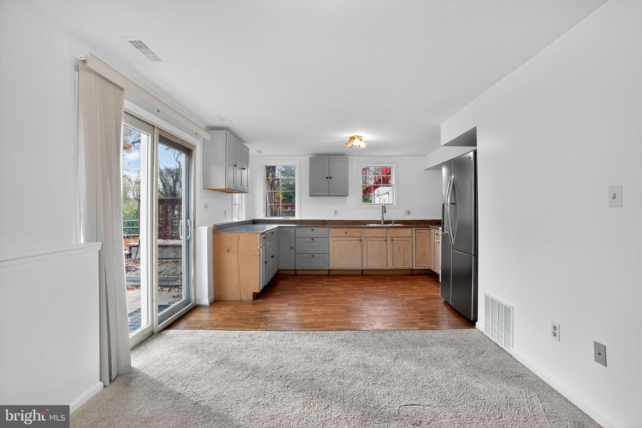 1513 Rainbow Drive Silver Spring, MD 20905 - Photo 36 of 58 a view of a kitchen with a sink cabinets and a window