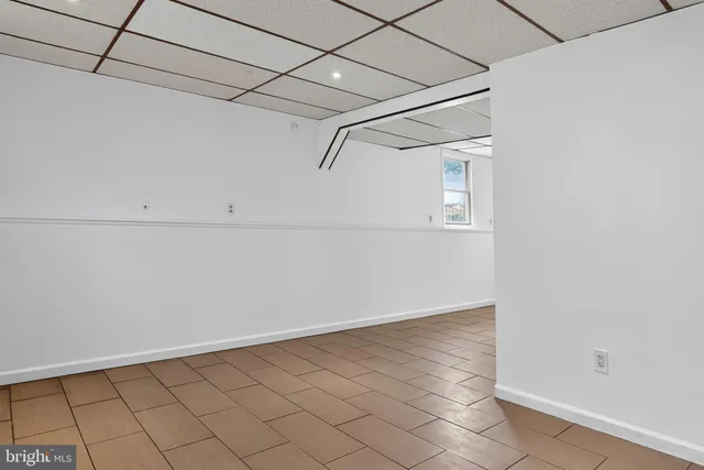 a view of a room with white walls