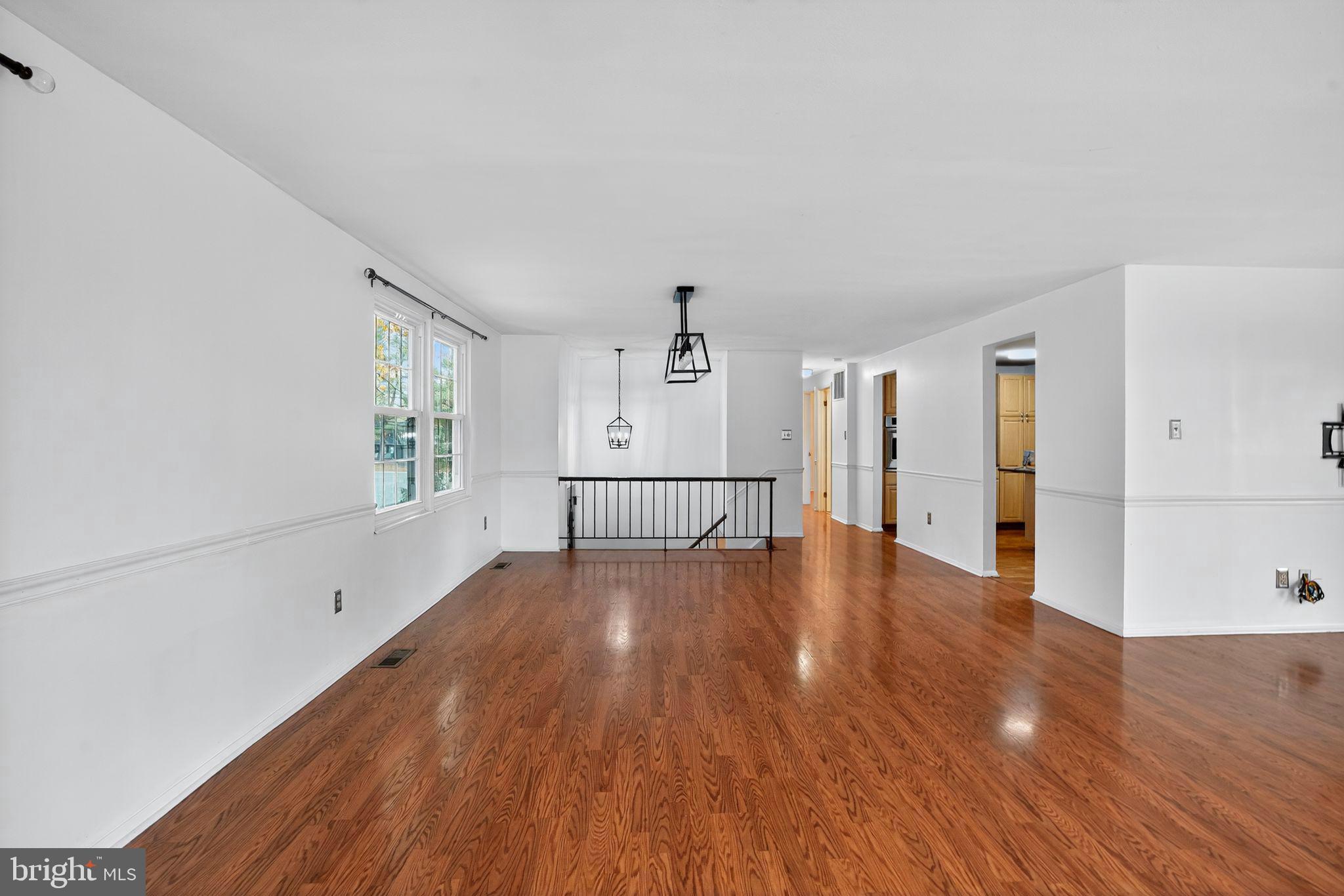 1513 Rainbow Drive Silver Spring, MD 20905 - Photo 6 of 58 a view of a livingroom with wooden floor