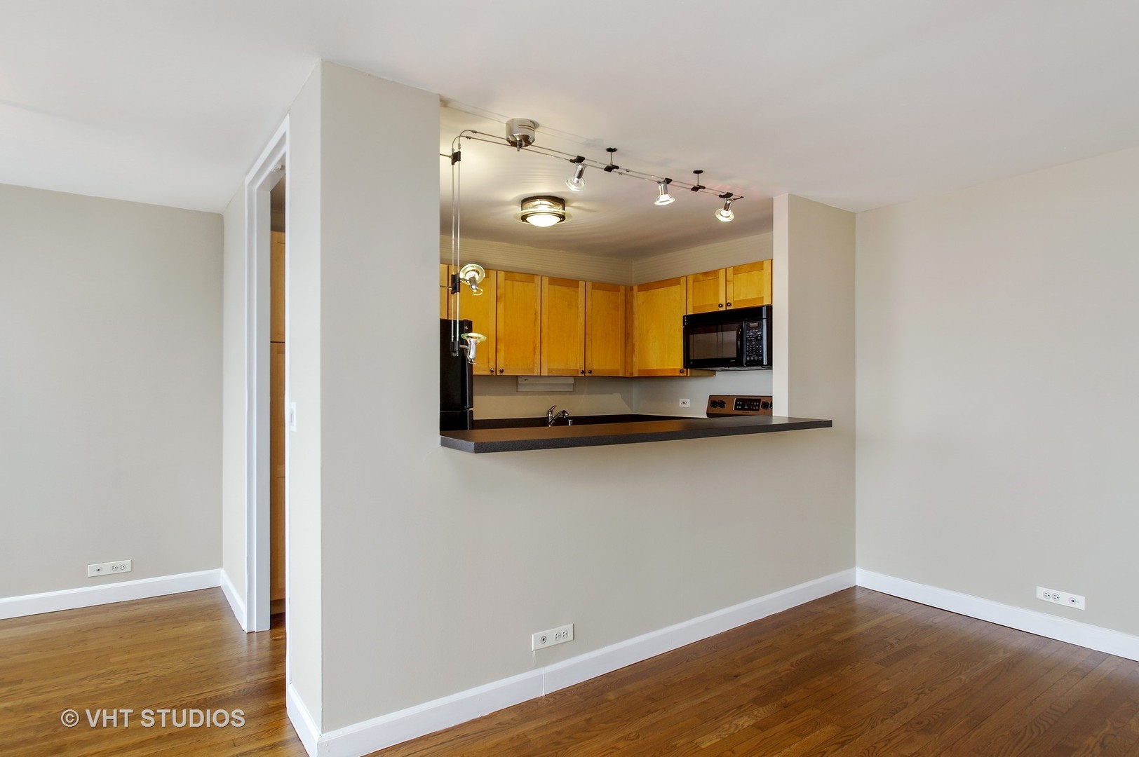 655 West Irving Park Road, Unit 2713 Chicago, IL 60613 - Photo 13 of 26 a view of a living room with hardwood floor