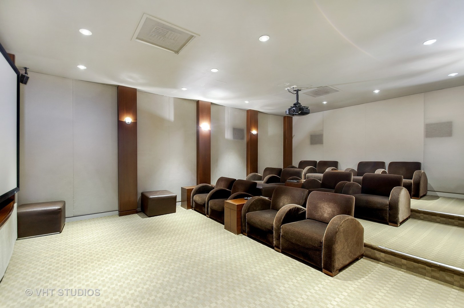 655 West Irving Park Road, Unit 2713 Chicago, IL 60613 - Photo 20 of 26 a media room with lots of chairs and a projector screen