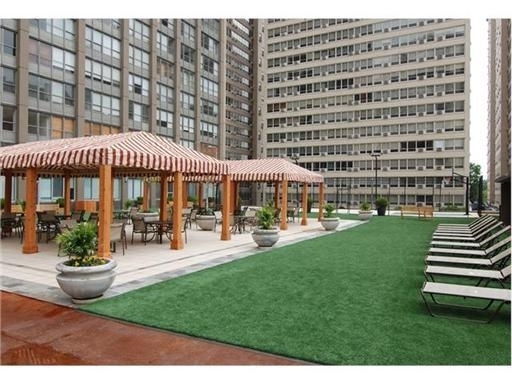 655 West Irving Park Road, Unit 2713 Chicago, IL 60613 - Photo 25 of 26 a front view of a building with sitting area