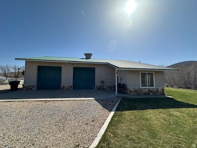 1454 East Little Sweden Road Heber City, UT 84032 - Photo 17 of 35 View of front of home featuring stone siding, a metal roof, driveway, and a front yard