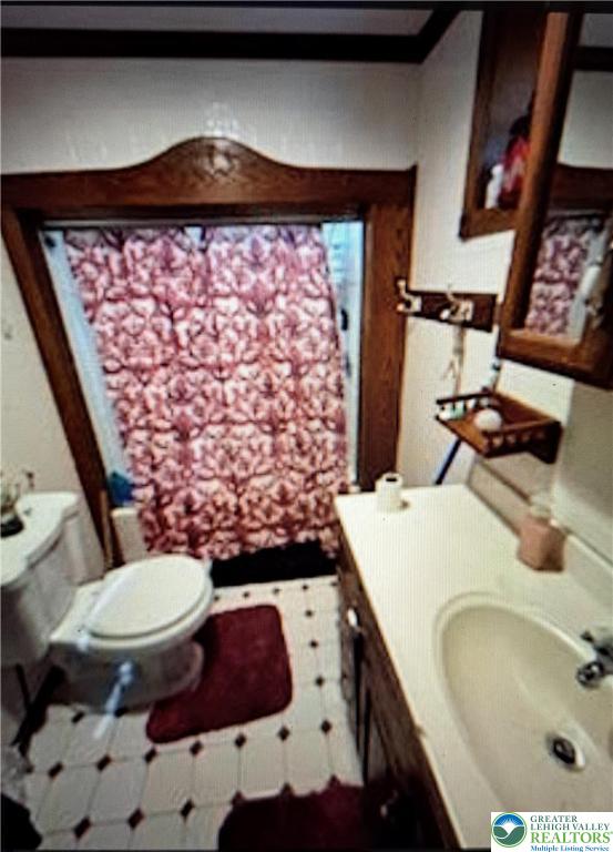 657 Lamb Street Bethlehem, PA 18015 - Photo 6 of 6 a bathroom with a sink and a toilet