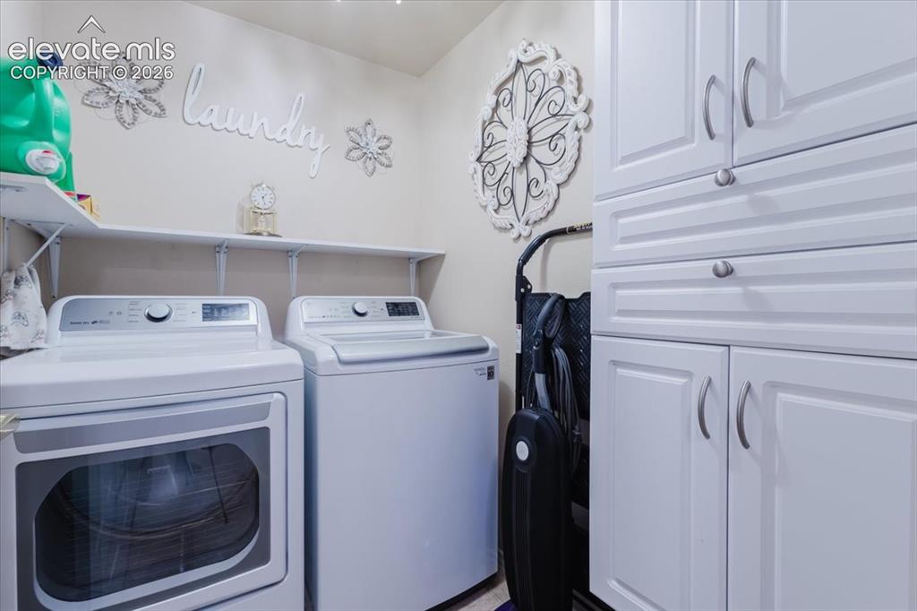 4008 Riviera Grove, Unit 103 Colorado Springs, CO 80922 - Photo 29 of 39 The laundry room come complete with washer and dryer and extra storage.
