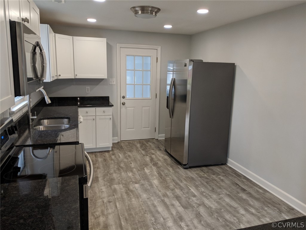 8523 Peaks Road Hanover, VA 23069 - Photo 12 of 35 a kitchen with a refrigerator and a stove top oven