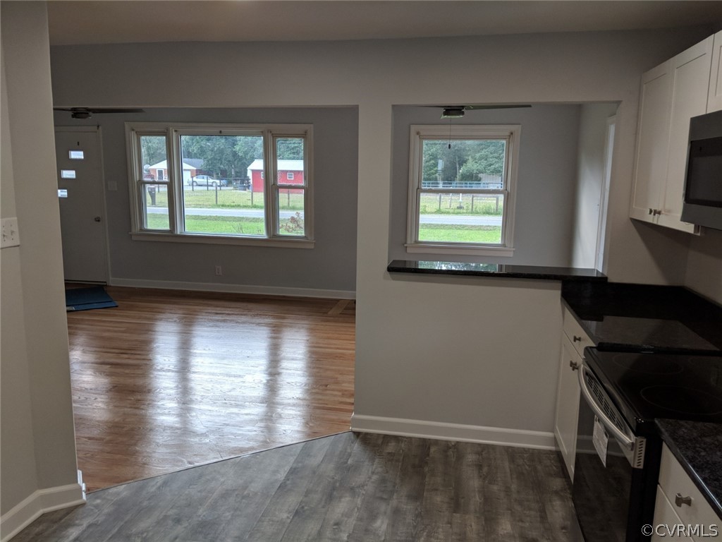 8523 Peaks Road Hanover, VA 23069 - Photo 14 of 35 wooden floor in an empty room with a window