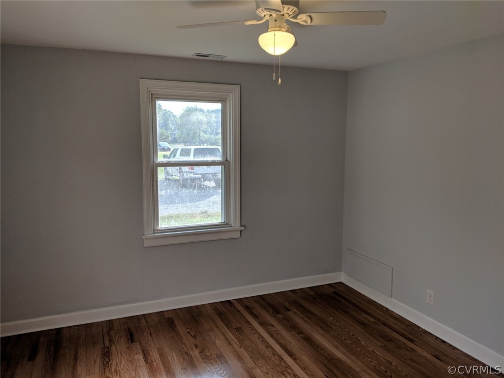 8523 Peaks Road Hanover, VA 23069 - Photo 17 of 35 a view of an empty room with wooden floor and a window