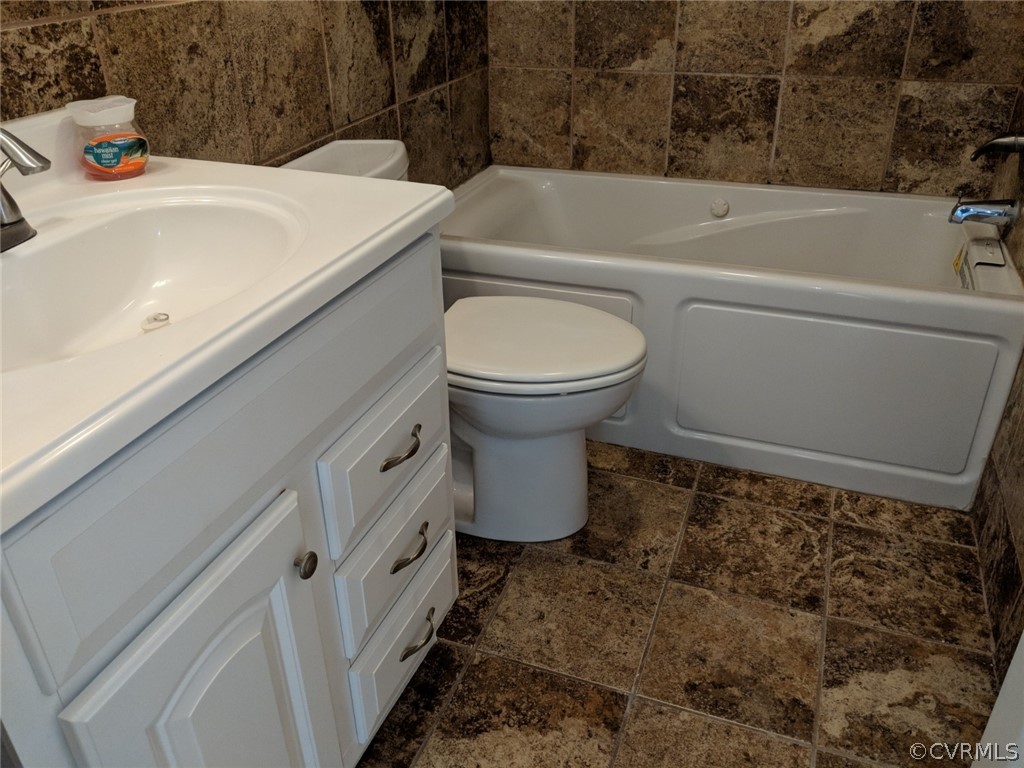 8523 Peaks Road Hanover, VA 23069 - Photo 19 of 35 a bathroom with a sink and a toilet