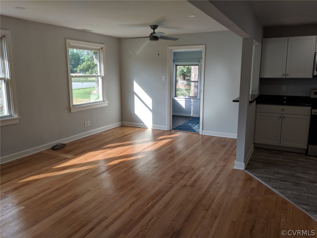 8523 Peaks Road Hanover, VA 23069 - Photo 10 of 35 an empty room with wooden floor cabinet and windows