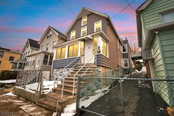 a front view of a house with a ocean view