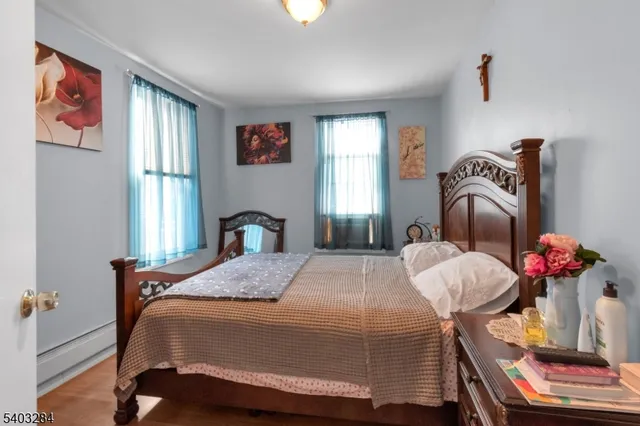 a bedroom with bed and window