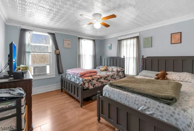 a bedroom with bed and window