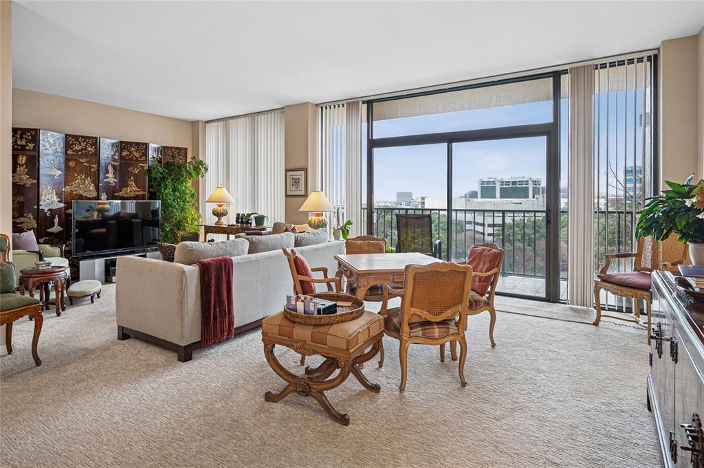 5200 Keller Springs Road, Unit 632 Dallas, TX 75248 - Photo 4 of 36 a living room with furniture and a large window