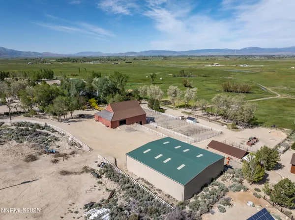a view of a house with wooden fence