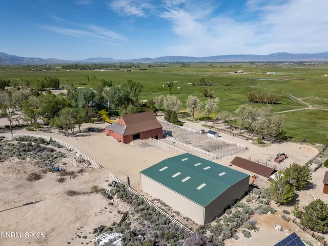 a view of a house with wooden fence