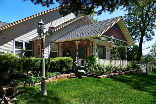 a view of house with wooden floor and a gate
