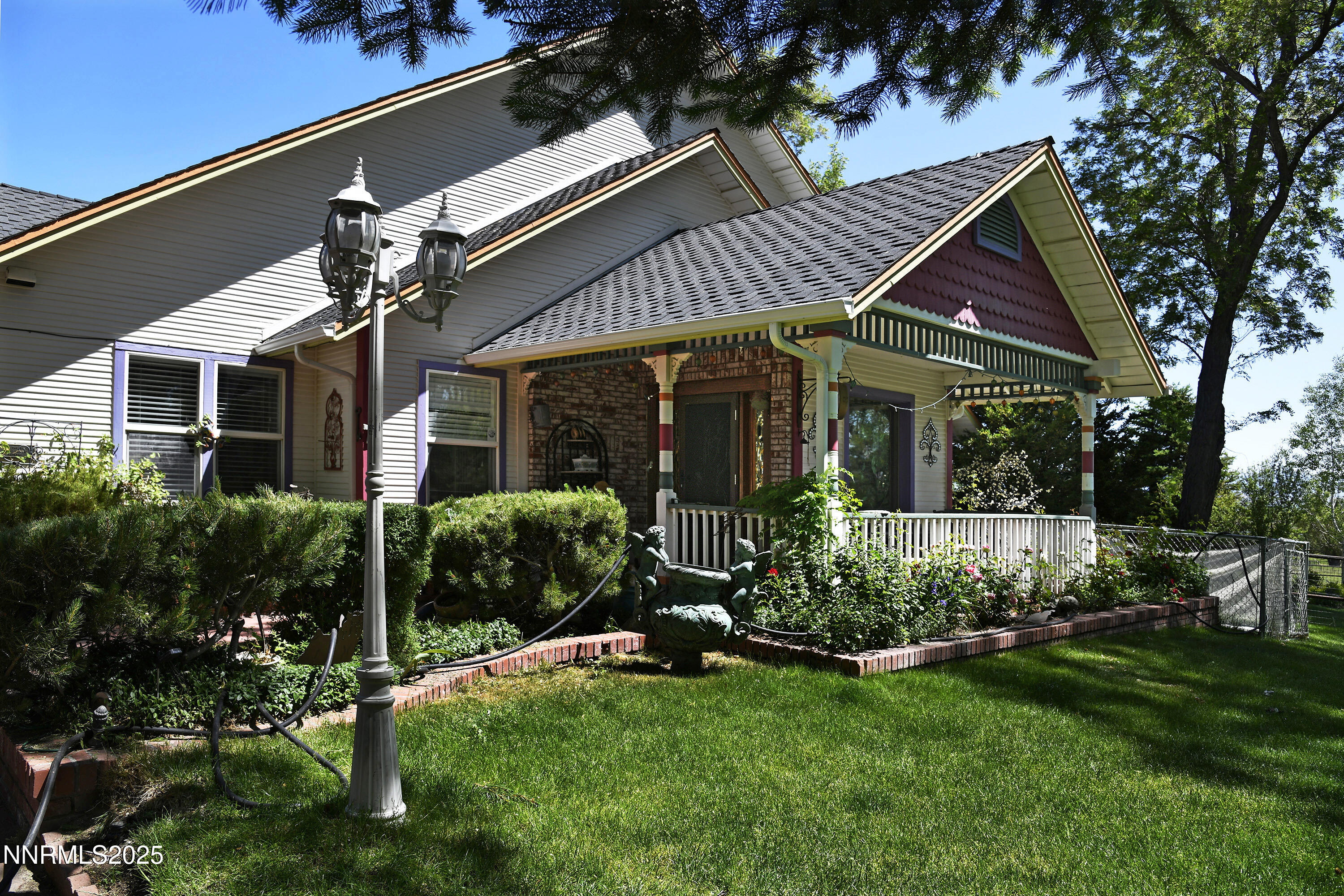 775 Foothill Road Gardnerville, NV 89460 - Photo 16 of 90 a front view of a house with a garden and plants