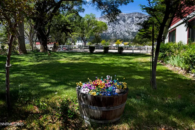 a kitchen with stainless steel appliances granite countertop a refrigerator and a stove