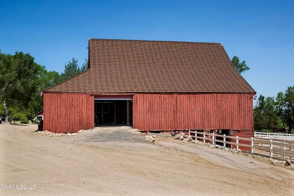 a en suite bathroom with a sink double vanity and a mirror