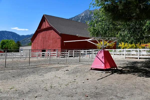 a bathroom with a granite countertop sink toilet a mirror and shower
