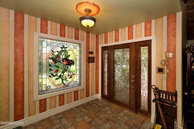 a kitchen with granite countertop lots of clutter and stainless steel appliances