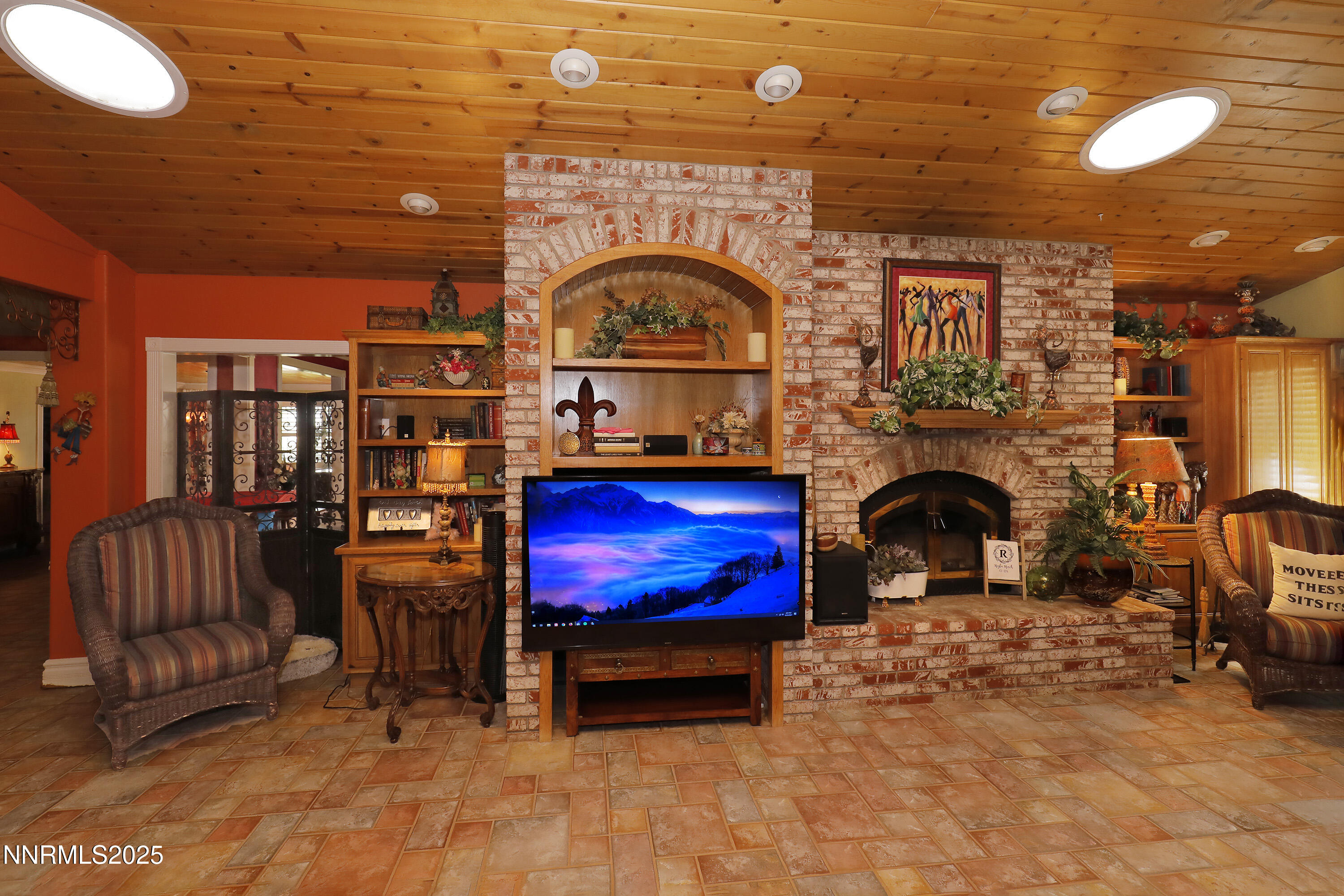 775 Foothill Road Gardnerville, NV 89460 - Photo 33 of 90 a living room with furniture a rug and a fireplace
