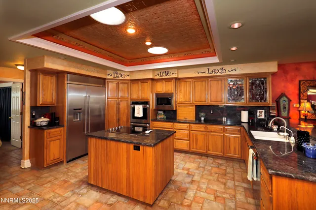 a kitchen with a cabinets and a refrigerator