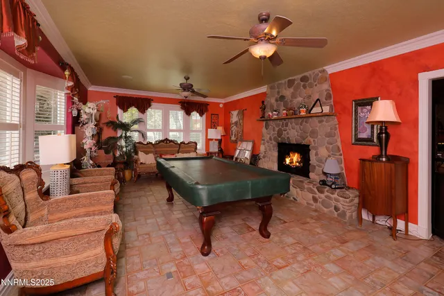 a bedroom with a balcony a bed and a tv on table