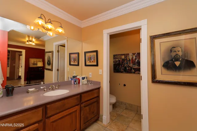 a bed room with a bed and a chandelier