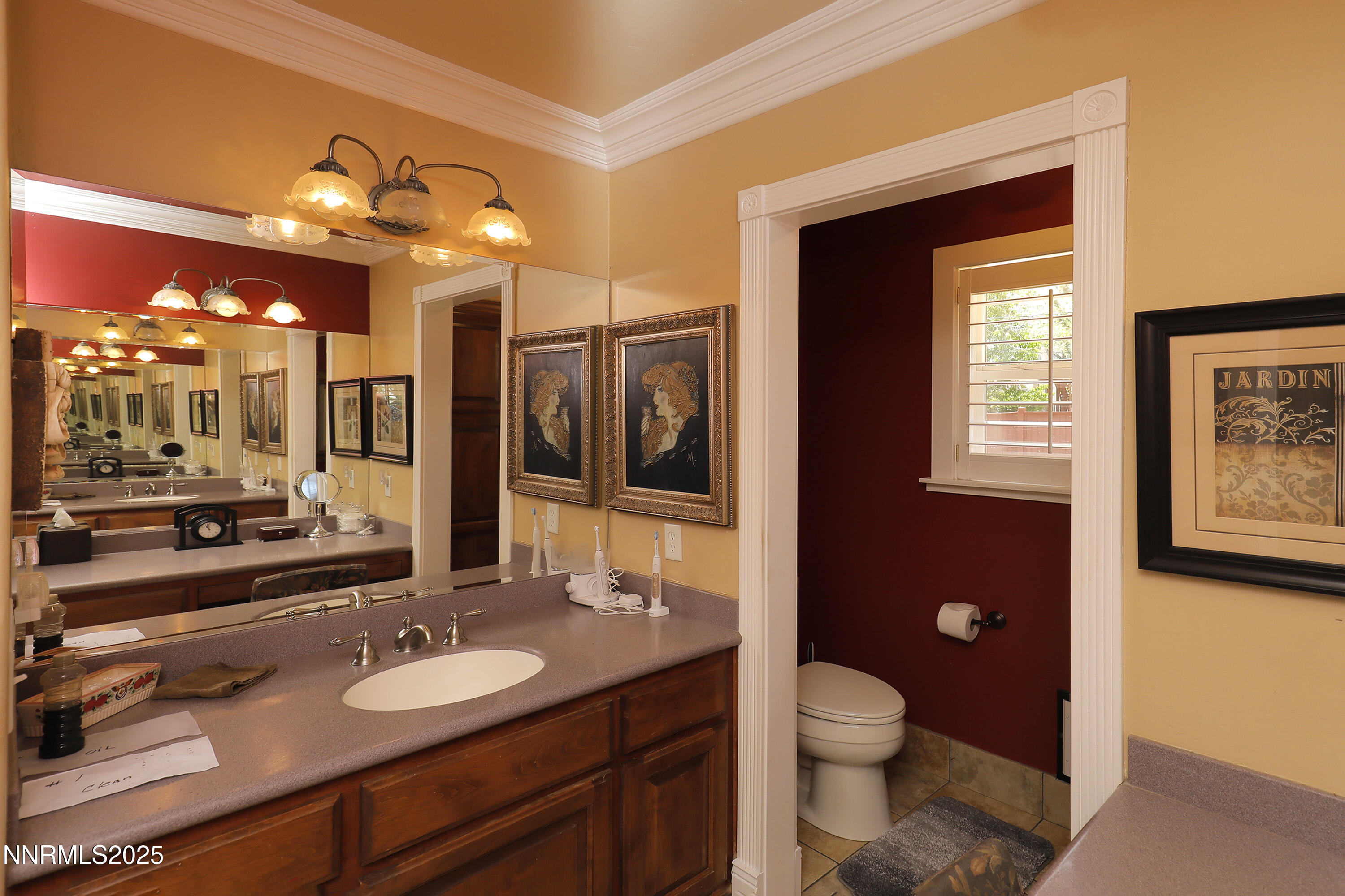 775 Foothill Road Gardnerville, NV 89460 - Photo 45 of 90 a bathroom with a granite countertop sink toilet a mirror and shower
